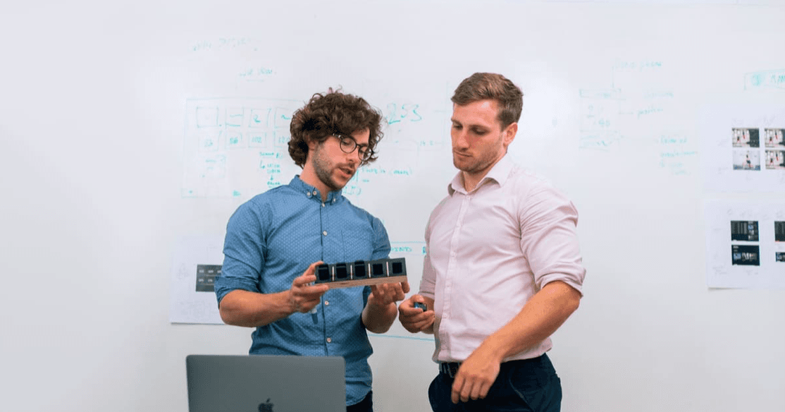 A team of engineers in a meeting discussing project coordination